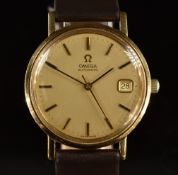 Omega gold gentleman's automatic wristwatch with black and gold gold hands, two-tone baton hour