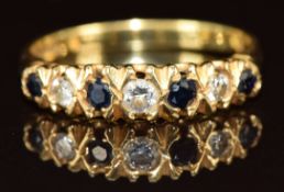 An 18ct gold ring set with diamonds and sapphires, 2.7g, size N