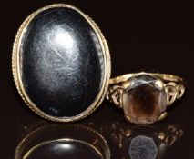 A 9ct gold ring set with onyx and a 9ct gold ring set with a smoky quartz, 10.3g, sizes M & Q