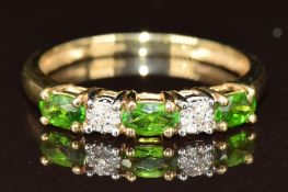 A 9ct gold ring set with green garnets and diamonds, 2.1g, size S