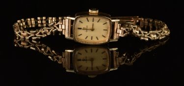 Omega 9ct gold ladies wristwatch with two-tone hands and baton hour markers, gold dial and signed 17