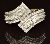 A 9ct gold ring set with baguette and round cut diamonds, 3.4g, size L