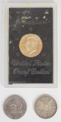 1921 USA Morgan silver dollar together with a 1971 cased Eisenhower proof example and 1976