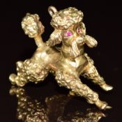 A 9ct gold charm/ pendant in the form of a poodle, 13.0g, 3.3cm
