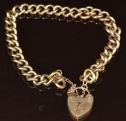 A 9ct gold curb link bracelet with 9ct gold heart padlock clasp, 18cm long, 22.3g.