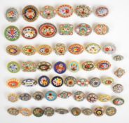 Fifty-five micro mosaic brooches including two 'Roma' examples and 19thC examples, all floral scenes
