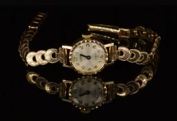 Roamer 9ct gold ladies wristwatch with blued hands and Arabic numerals, silver dial and signed 17