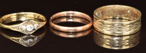 An 18ct gold ring set with three diamonds (1.8g, size M), a 9ct rose gold wedding band (size J)