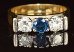 An 18ct gold ring set with a round cut sapphire of approximately 0.3ct and two round cut diamonds,
