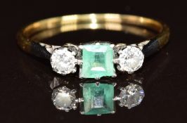 An 18ct gold ring set with an emerald and two round cut diamonds, each approximately 0.15ct, 2g,