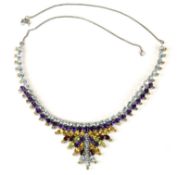 A white metal necklace set with oval cut topaz, amethyst, citrines, garnets and peridot, 51g