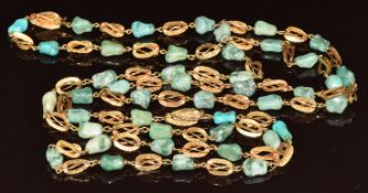 A 9ct gold and turquoise necklace made up of beads and cage shaped textured links, 61.5g, 102cm