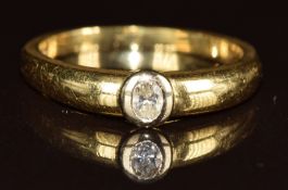 An 18ct gold ring set with an oval cut diamond of approximately 0.18ct, 4.3g, size O