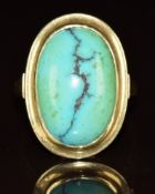 A 14k gold ring set with a turquoise cabochon, 4.9g, size N