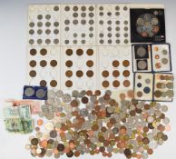 A quantity of UK coinage George III onwards, includes some sets, crowns, banknotes, redeemable