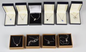 Four silver pendants set with diamonds, five silver pendants set with enamel and diamonds and a