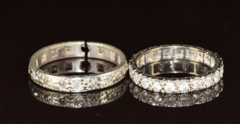 An 18ct white gold eternity ring set with diamonds (damaged, 2.3g) and a 15ct gold eternity ring (