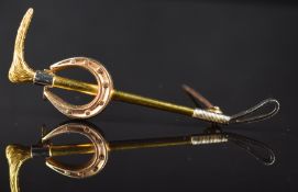 A 9ct gold brooch in the form of a riding crop and horseshoe, 5.3g, 5.6cm
