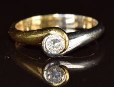 An 18ct gold bi-coloured gold ring set with a round cut diamond of approximately 0.25ct, 4.3g,