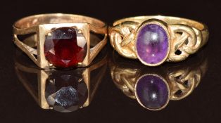 Two 9ct gold rings, one set with a round cut garnet and the other an amethyst cabochon, 4.7g,