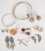 A silver serpent flapper bangle, a white metal serpent bangle, five pairs of silver/ white metal