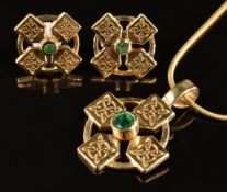 A 9ct gold pendant in the form of a cross set with an emerald on snake chain, with matching