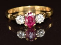 An 18ct gold ring set with a ruby and diamonds, 3.3g, size Q
