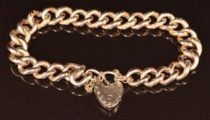 A 9ct rose gold curb link bracelet with alternating engraved links with heart padlock clasp, 18.