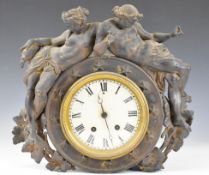 19th century mantel or similar clock surmounted by two cherubs, the two train movement striking on a
