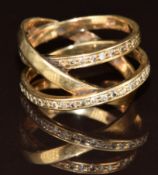 A 9ct gold ring set with diamonds in a three band crossover setting, 6.2g, size S