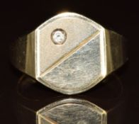 A 9ct gold signet ring set with a diamond, 6.4g, size R
