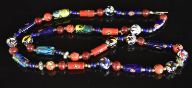 Glass beaded necklace made up of circular and elongated millefiori beads, 161g