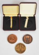 Two cased bronze medal coins comprising Elizabeth II 1953 and a Churchill example, together with