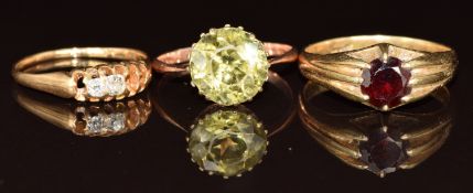 An 18ct gold ring set with a round cut garnet (6.4g, size S), a 9ct rose gold ring set with a