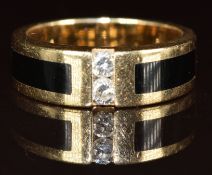 A 14k gold ring set with onyx and two diamonds, 6.1g, size M