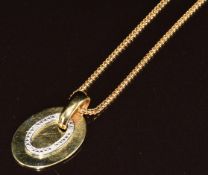 An 18ct gold bi-coloured pendant set with diamonds (2.7cm) on 18ct gold chain, 48cm, 10.2g