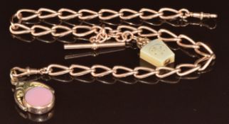 A 9ct rose gold double Albert / watch chain made up of twisted oval links (22g) with 9ct gold swivel