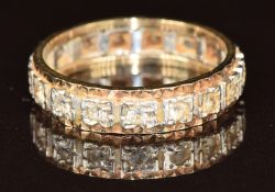 A 9ct gold bi-coloured eternity ring set with synthetic stones, size N
