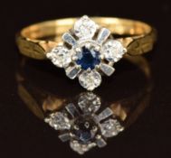 An 18ct gold ring set with a sapphire and diamonds, 2.4g, size L