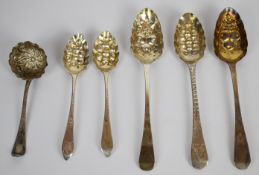 Five Georgian hallmarked silver berry spoons and a similar ladle, four being Edinburgh, length of