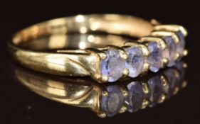 A 9ct gold ring set with five oval cut tanzanites, 1.7g, size P