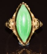 An 18k gold ring set with a marquise cut jadeite cabochon, 4.4g, size J