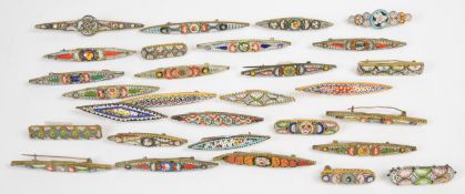 Twenty-one marquise shaped micro mosaic brooches including three 'Roma' examples and eight