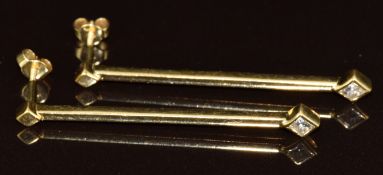 A pair of 18ct gold earrings, each set with a princess cut diamond of approximately 0.15ct, 6.2g,