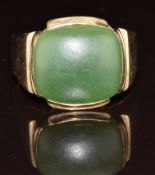 A 9ct gold ring set with a jadeite cabochon, 9.6g, size X