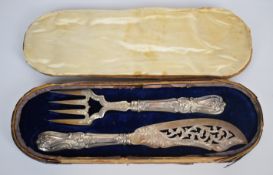 Cased pair of Victorian hallmarked silver fish servers with pierced and engraved decoration,