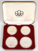 Set of four 1976 Montreal Olympics commemorative silver coins comprising two each of $10 and $5