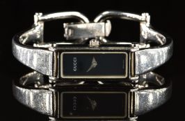 Gucci ladies wristwatch ref. 1500L with steel dauphine hands, black dial, stainless steel case and