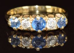 An 18ct gold ring set with sapphires and diamonds, 2.4g, size J