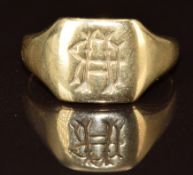 A yellow metal signet ring (tests as 9k gold), 3.6g, size L